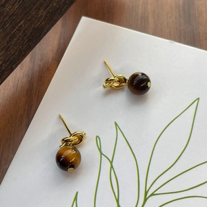 S925 sterling silver tiger eye knot earrings featuring golden twist design and brown gemstone