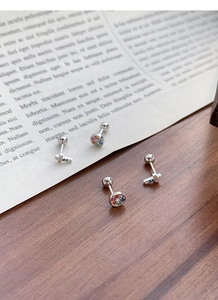 Detail of S925 silver round and cross studs with rainbow zircons and screw ball backs