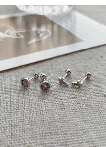 Macro shot of S925 sterling silver colorful crystal round and cross stud earrings set