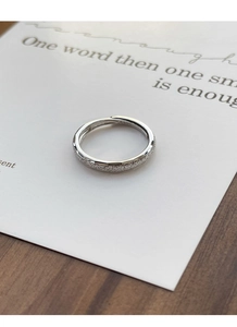 Macro detail of S925 sterling silver ring showing frosted texture and hallmark stamp