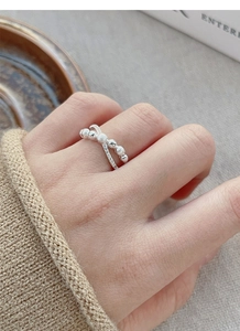 Detailed close-up of S925 silver double-layer cross ring with beads and crystals