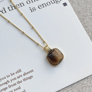 Square tiger eye stone pendant on a gold beaded chain necklace with s925 silver finish