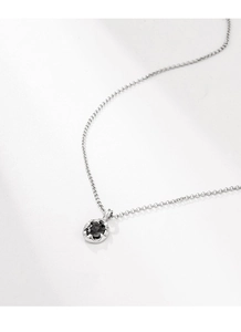 Detailed macro view of S925 silver necklace featuring a round black stone pendant inlay