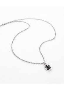 Macro detail of S925 silver necklace featuring an oval black gemstone pendant in vintage style