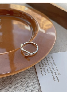 Macro detail of S925 sterling silver ring showing the engraved hallmark on the inner band