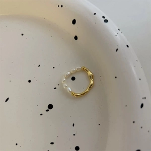 Detailed view of the S925 silver ring featuring half freshwater pearls and half gold texture