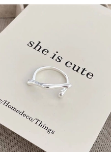 Macro detail of S925 sterling silver minimalist irregular wave open ring design