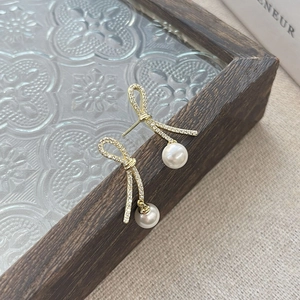 Elegant S925 silver bowknot pearl earrings with gold plating and sparkling zircon stones