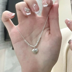 Elegant S925 sterling silver necklace with heart pendant and textured beads for women