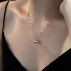 Minimalist S925 sterling silver necklace featuring a round pendant on a thin box chain
