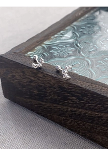 Detailed view of S925 sterling silver mini croissant studs with secure screw back closure