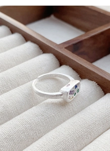 Macro detail of S925 sterling silver ring with colorful stones and matte finish