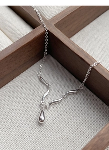 Detailed view of an S925 sterling silver teardrop pendant on a refined necklace
