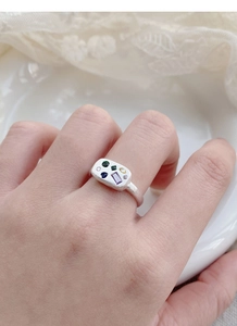 Detail of S925 sterling silver frosted ring with colorful zircon stones on woman's hand