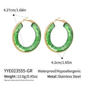 Detail view of large green marble resin hoop earrings with waterproof gold stainless steel