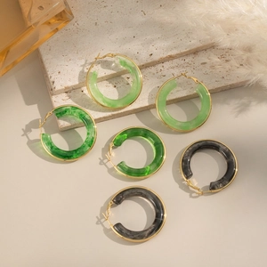 Detailed set of resin hoop earrings in green and black marble texture with gold clasps