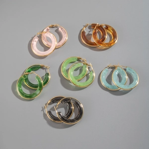Detailed close-up of marble pattern resin hoop earrings in six vibrant colors