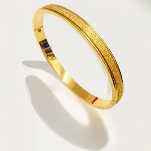 Elegant gold frosted stainless steel bracelet featuring a minimalist luxury design