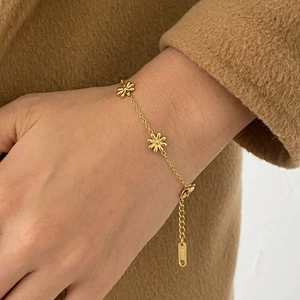 Gold stainless steel daisy bracelet with three flower charms and adjustable chain link