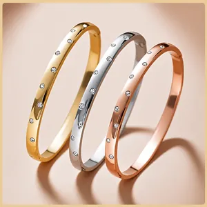 Set of minimalist stainless steel bangles with sparkling crystal inlay in three colors