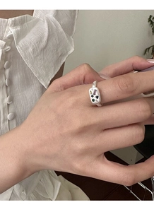 Detail of S925 silver matte ring with colorful cubic zirconia on model's hand