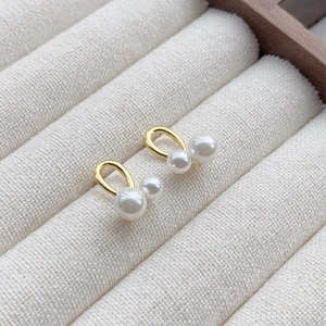 Élégantes boucles d'oreilles S999 en argent avec double perle et finition dorée