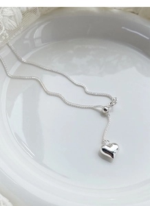 Detail of S925 sterling silver heart necklace with adjustable sliding bead and lobster clasp