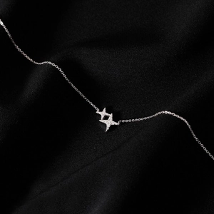 Minimalist S925 sterling silver necklace with sparkling double star pendants on black fabric