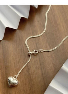 Detail of S925 sterling silver heart necklace with adjustable sliding ball and spring clasp
