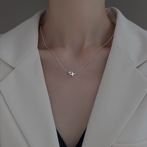 Minimalist S925 sterling silver star pendant necklace shown on professional model