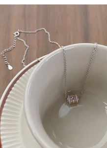 Close-up of S925 silver cylinder necklace with pink and white cubic zirconia crystals