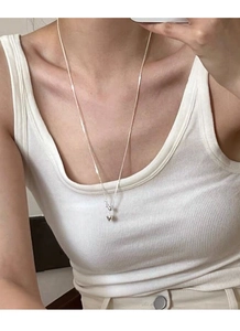 Close-up of S925 sterling silver heart pendant necklace on collarbone for women