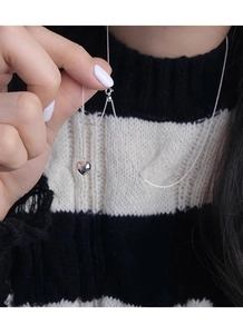 Close-up of S925 silver heart pendant necklace with adjustable chain on model