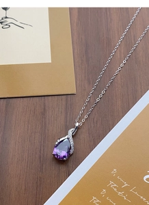 Close-up of S925 sterling silver necklace with purple waterdrop pendant and small diamonds