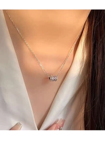 Close-up of S925 silver cylinder necklace featuring pink and white pavé cubic zirconia
