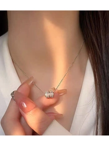 Close-up of S925 silver cylinder necklace with pink pavé crystals on rose gold plating