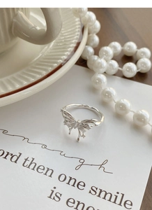 Detailed view of irregular 925 sterling silver butterfly ring with cubic zirconia inlay