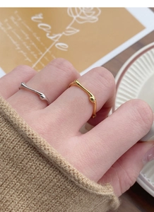Detailed view of irregular textured S925 silver rings in gold and silver finish