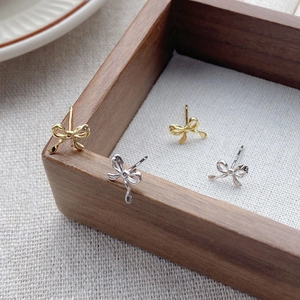 Elegant S999 silver bow stud earrings in gold and silver finish for women