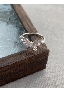 Close-up of S925 sterling silver butterfly ring showing brushed metal and zircon details