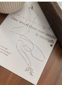 Detailed macro view of S925 silver heart key necklace with sparkling zircon pendant