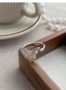 Close-up of S925 sterling silver butterfly ring with cubic zirconia inlay details