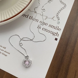 Elegant S925 sterling silver heart necklace with pink zircon on minimalist white card