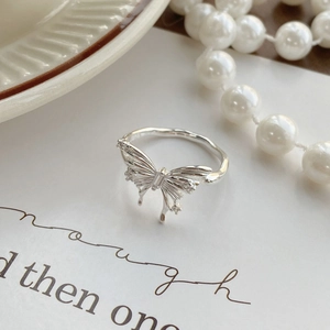 Elegant 925 sterling silver butterfly ring with sparkling zircon stones on a white card