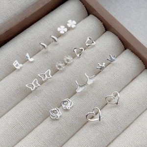 Elegant S999 sterling silver stud earrings set featuring heart and clover designs