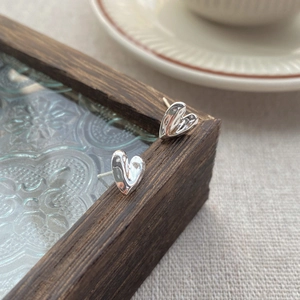 Minimalist S999 silver heart stud earrings with unique textured finish and S925 hallmark