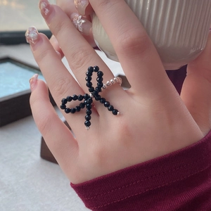 Handmade S925 silver beaded ring with black crystal bow on a stretch cord for women