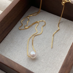 Elegant S925 sterling silver necklace with a single white baroque pearl on gold chain