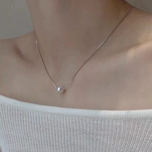 Elegant S925 sterling silver necklace featuring a single round freshwater pearl pendant