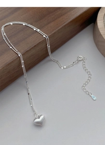Detail shot of S925 sterling silver heart necklace showing the S925 hallmark on the clasp